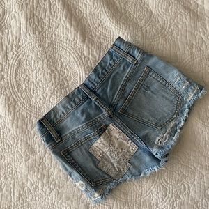 Free People True Believer Patched Cutoffs Blitz